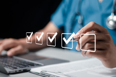 Doctor fills out the medical survey paperwork